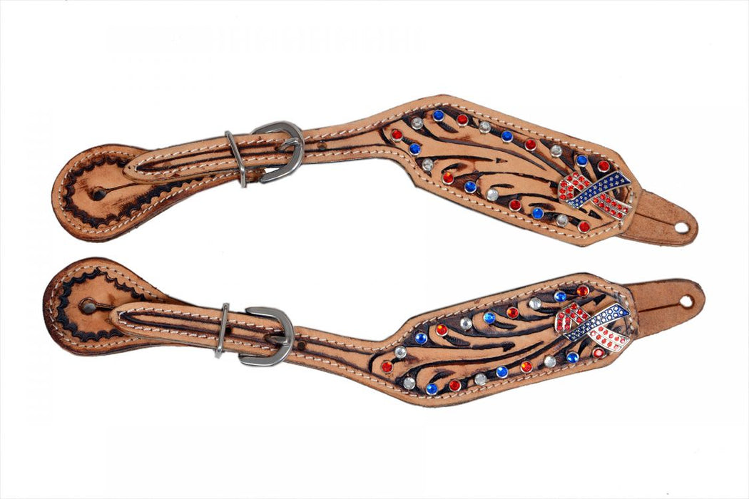 Floral tooled spur straps with red white and blue gems.